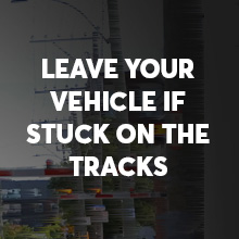 Leave You Vehicle if Stuck on the Tracks